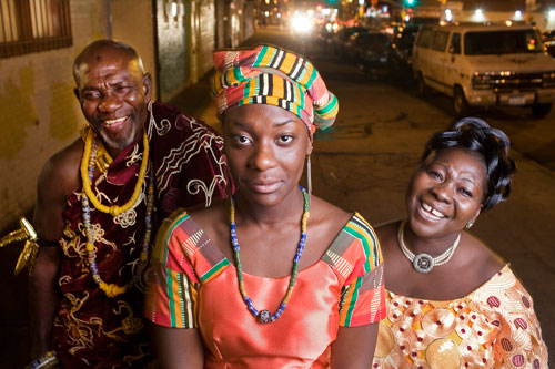 Rocky Otoo, 17, stands with her father, Nii Adjedu I, left, and her mother
