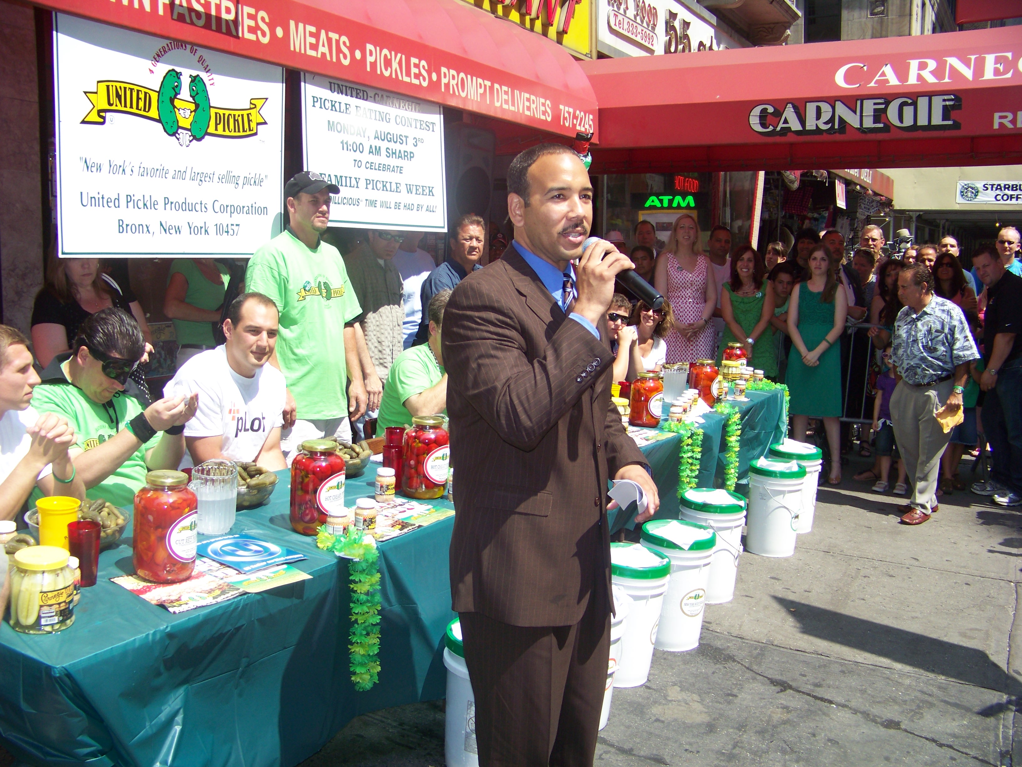 Bronx Borough President Diaz judges Pickle Eating Contest.
