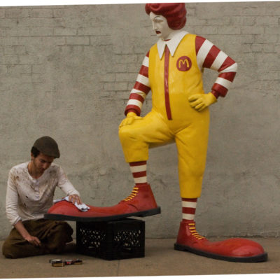 Banksy’s “Shoe Shine Boy” Jabs At Ronald McDonald
